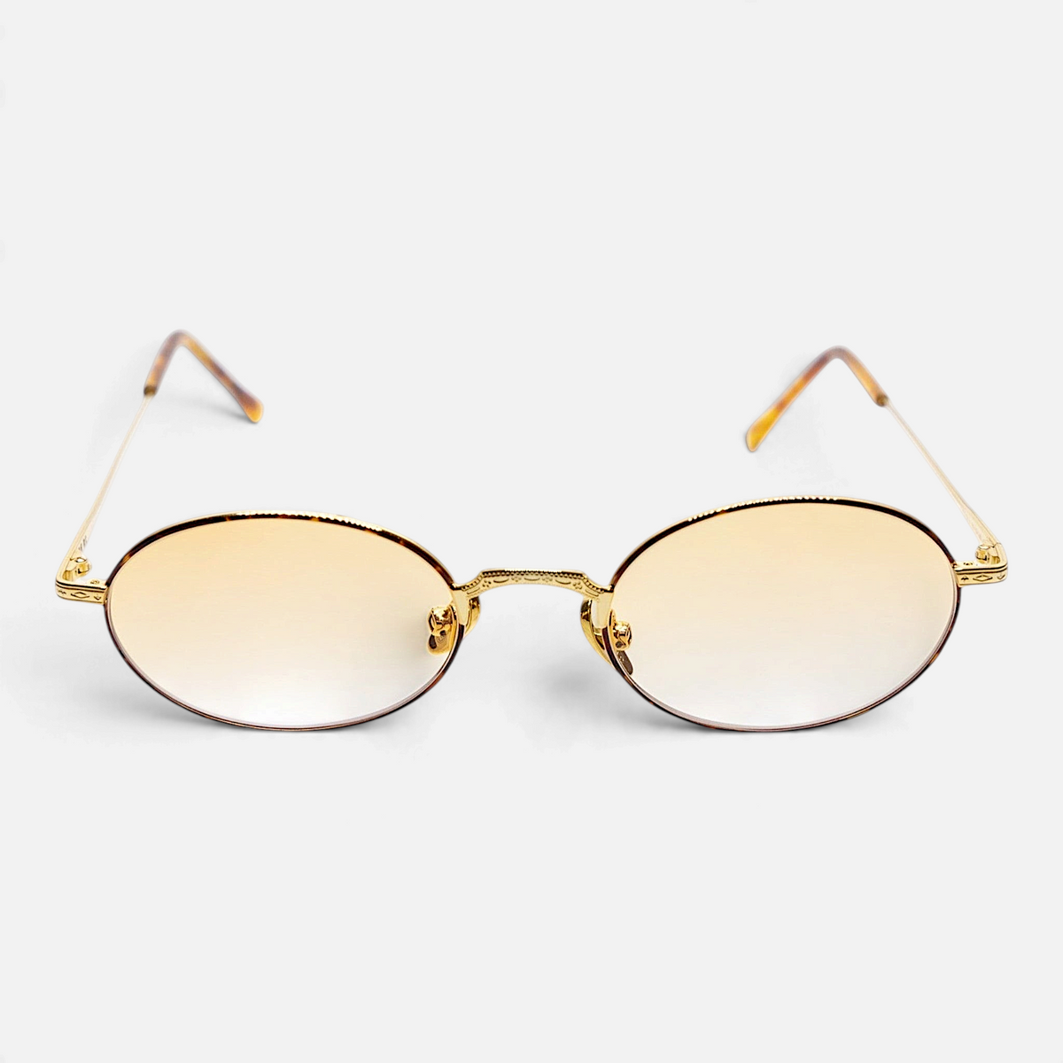 Occhiali Bottega di Sguardi Catalina II con montatura ovale dorata e lenti sfumate color ambra