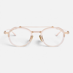 Occhiali da vista Bottega di Sguardi Akoni Infinity con montatura rotonda in acetato trasparente e titanio dorato